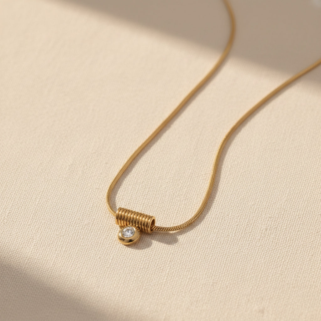 Snakeskin Chain Necklace with Spiral Pendant in Gold | THE HUBBELL COLLECTIVE